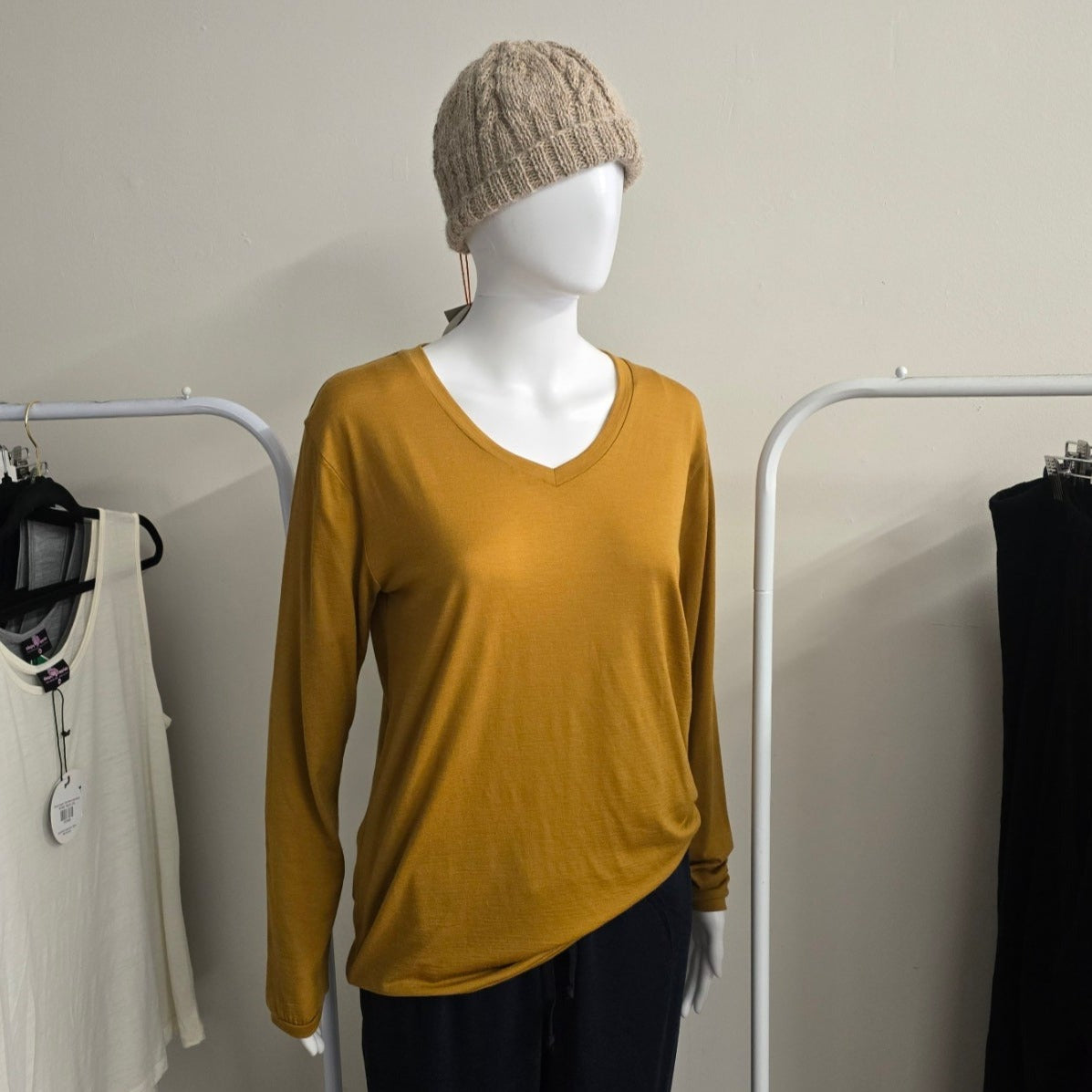 mustard Merino long sleeve tee on mannequin