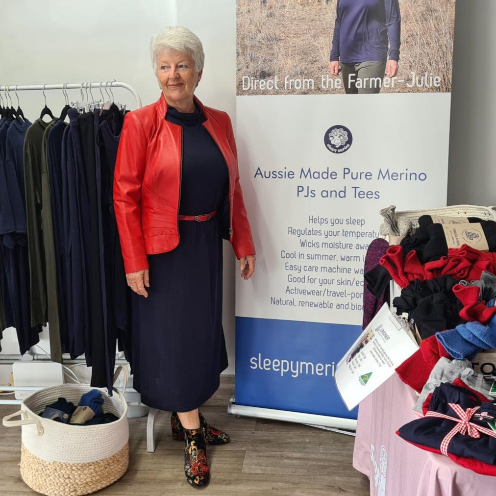 Deb wearing Sleepy Merino nightie as a day dress with red jacket and belt