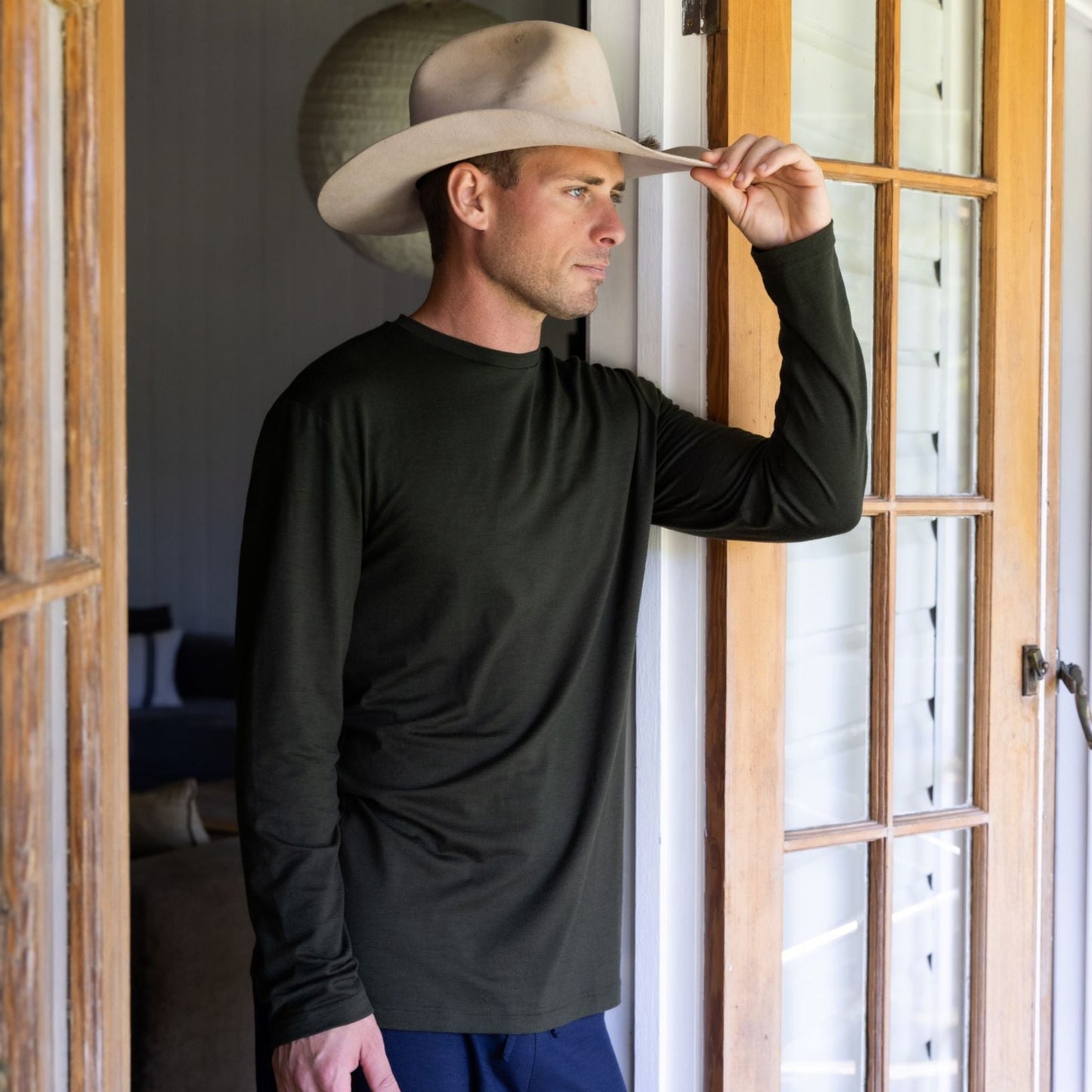 Man in hat wearing Merino tee