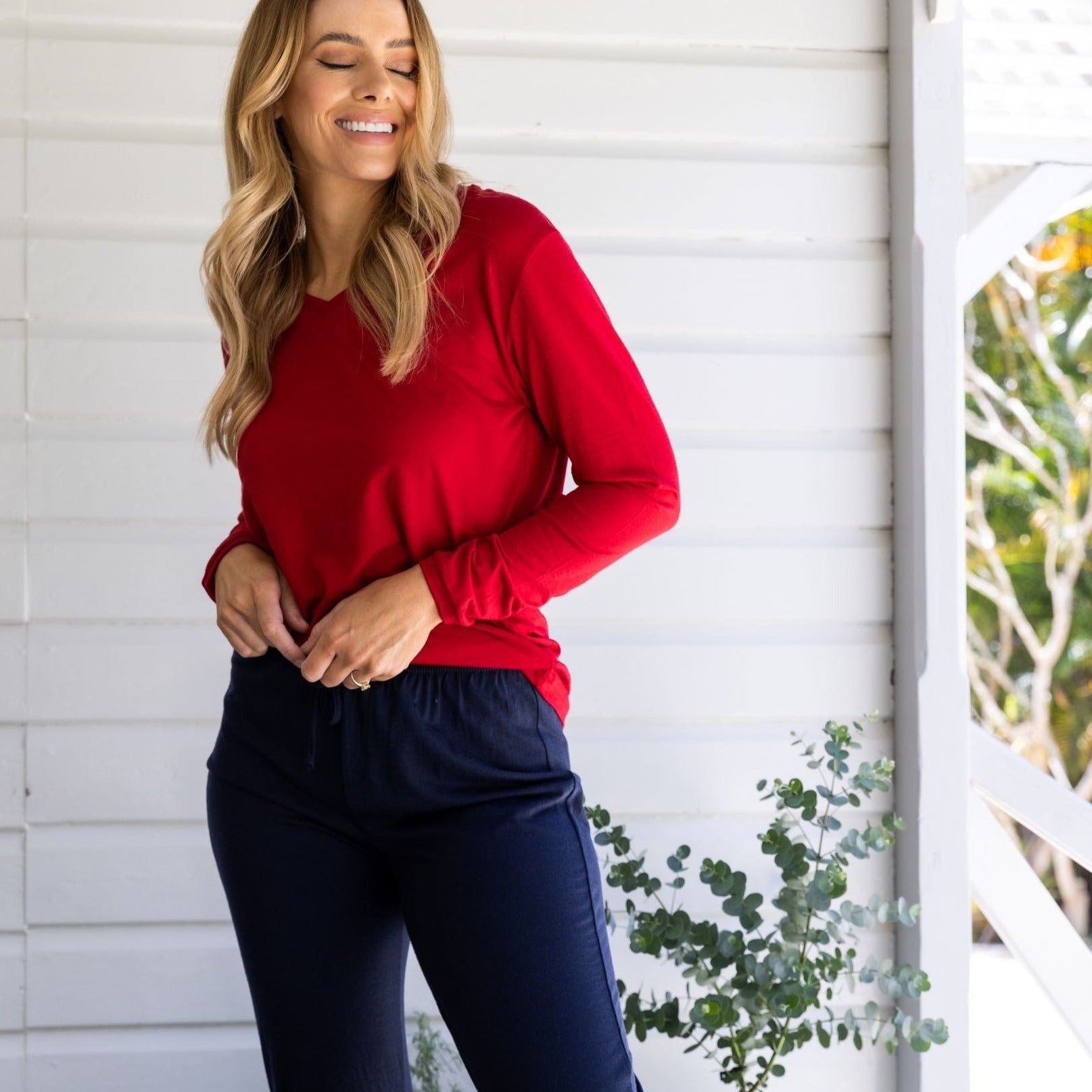 woman wearing Merino sleep and lounge pants with red tee