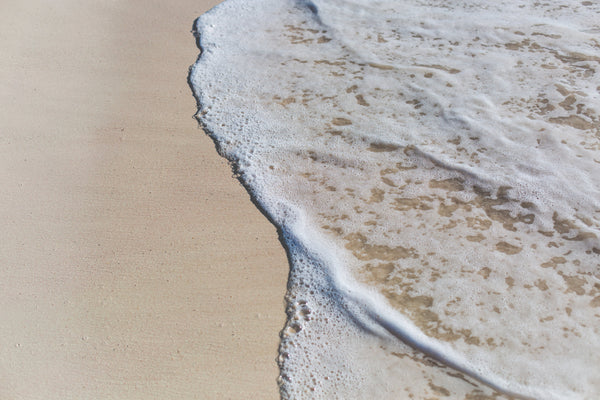 waves on a clean beach without plastic waste